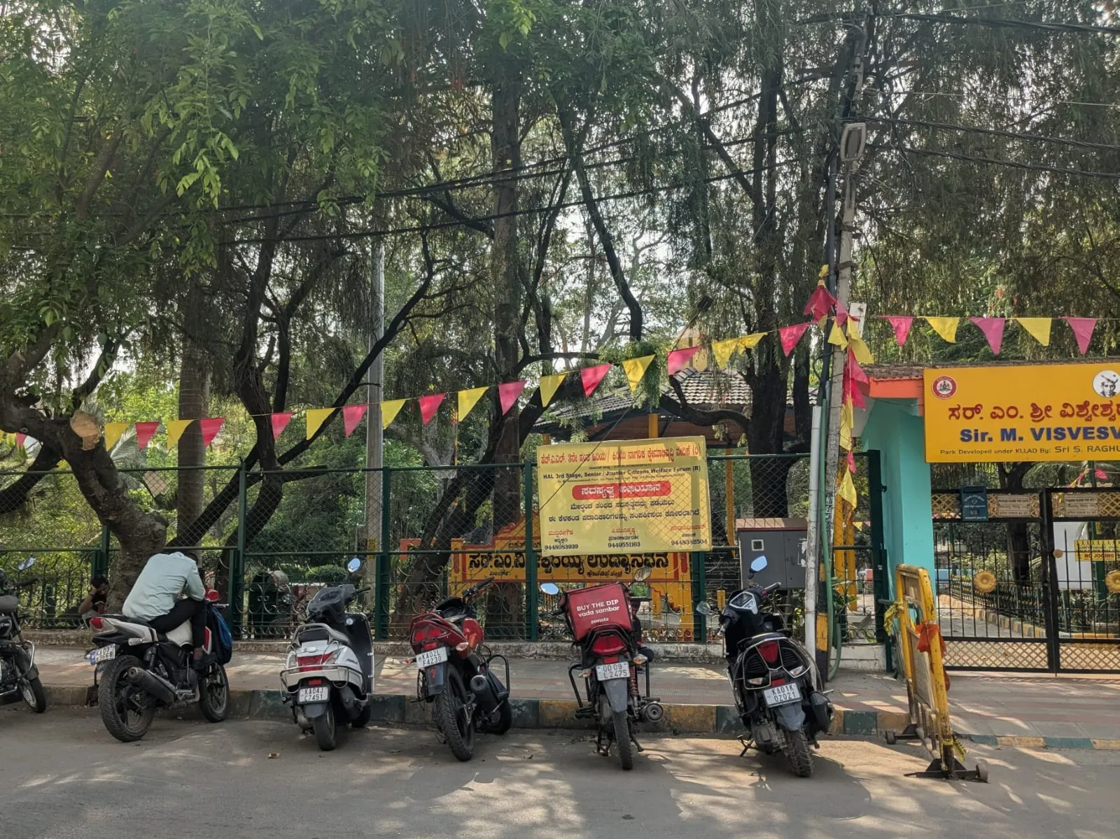A locked public park gate during daytime